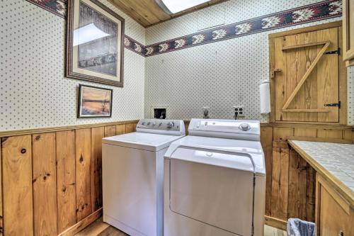 a laundry room with a washer and dryer at Bryson City Cabin with Hot Tub about 10 Mi to Dtwn! in Lauada