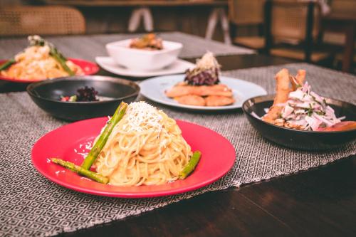 a table with plates of food on a table at Tambo del Arriero Hotel Boutique in Cusco