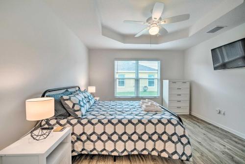 a bedroom with a bed and a ceiling fan at Home with Lanai and Golf Cart in The Villages in Wildwood