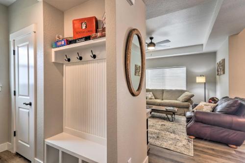 a living room with a mirror and a couch at Gorgeous Loveland Townhome Less Than 1 Mi to Downtown in Loveland