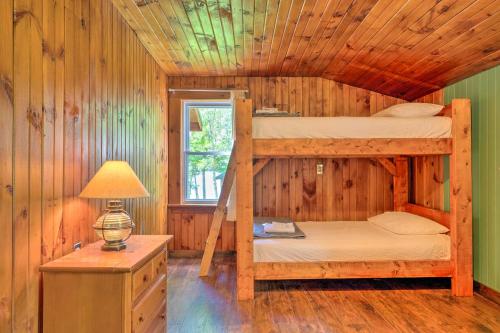 Una cama o camas en una habitación de Rustic Cabin Retreat on Rangeley Lake!