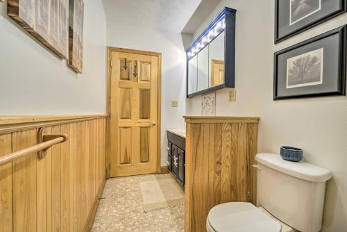 a bathroom with a toilet and a window at McArthur Cabin Peaceful Getaway on Farm! in Stella