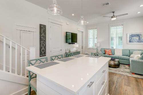 a kitchen and living room with a white counter top at Beach Days & Fairways in Port Aransas