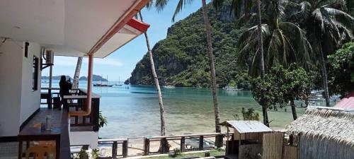 a view of the ocean from a house at Dreamland Nilo Eve Beach Guest Huaz in El Nido
