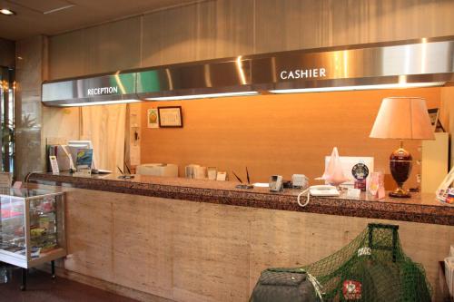 a lobby with a cashier counter in a store at Business Hotel Nissei in Osaka
