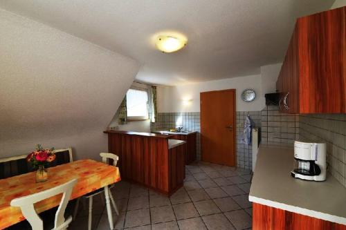 a kitchen with a table and a counter top at Ferienwohnung Himmelsbach in Gengenbach