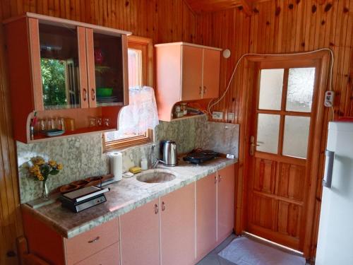 a kitchen with a sink and a counter top at Bungalow with access to a large garden near beach in Kemer