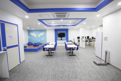an office with tables and chairs in a room at Namsan Guesthouse in Seoul