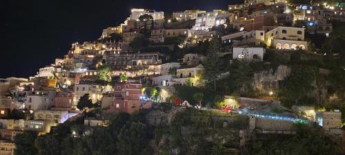 a village on the side of a mountain at night at Villa Maria Antonietta in Positano