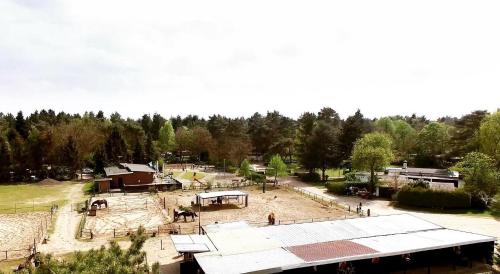 an aerial view of a park with a playground at Heerlijk bos chalet met ongekende rust en vrijheid in Nunspeet