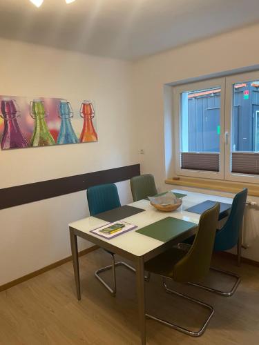 a room with a table and chairs and a window at Appartement Luna in Mittersill