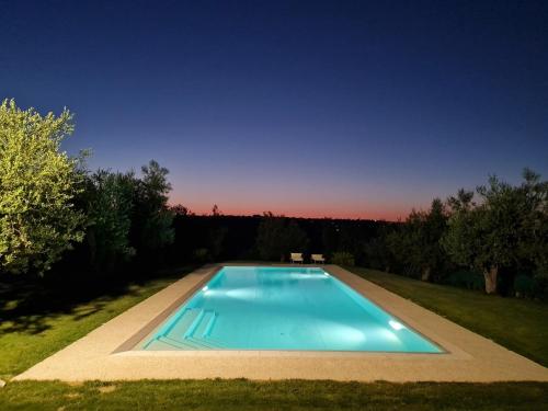 a swimming pool in the middle of a yard at Rocky House in Ripa Teatina