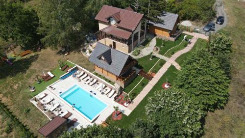 an aerial view of a house with a swimming pool at Apartmani Joka in Vrdnik