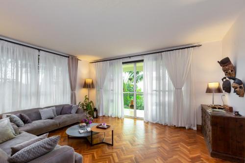 a living room with a couch and a table at Ewange - A Casa Mia in Kampala