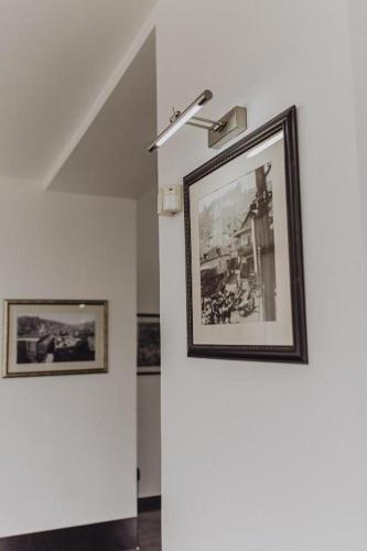 a room with two framed pictures on the wall at Millennium Tbilisi in Tbilisi City