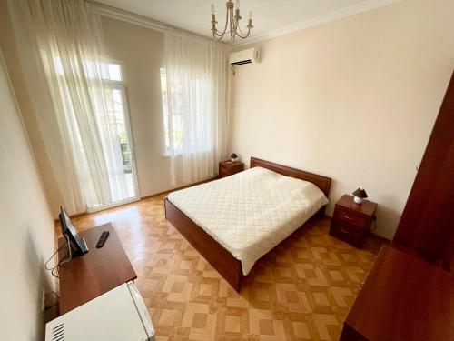 Кровать или кровати в номере Розалин Гостевой дом