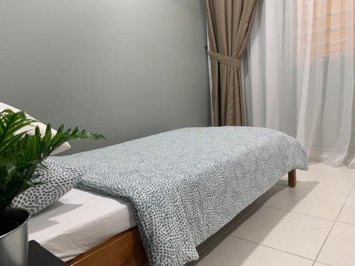 Postel nebo postele na pokoji v ubytování Rumah Sarah Semenyih