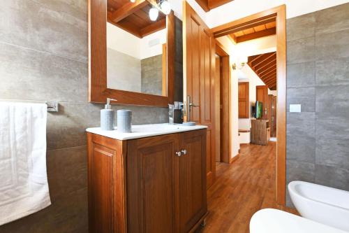 a bathroom with a sink and a toilet at Casa El Vendaval in Tijarafe