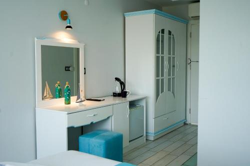 a bathroom with a sink and a mirror at NOVA PORT Boutique Hotel in Tekirdag