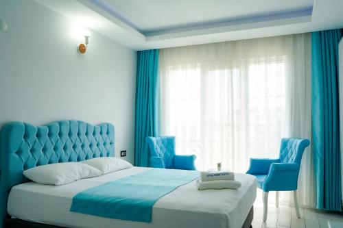 Ένα ή περισσότερα κρεβάτια σε δωμάτιο στο NOVA PORT Boutique Hotel