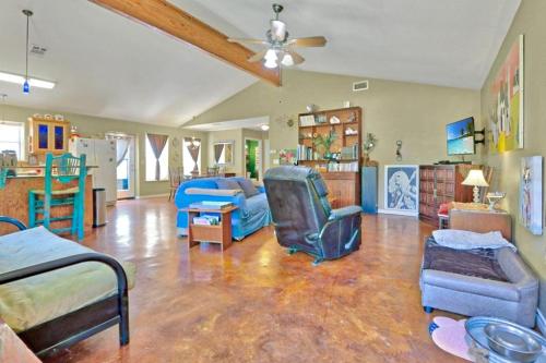 a large living room with a bed and a couch at Three Horses Ranch in Johnson City