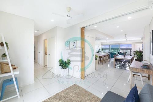 a view of the living room and dining room of a house at ZEN SEA BREEZE - Darwin's Premier Family Apt in Darwin