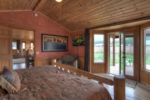 a bedroom with a large bed in a room at Stapp Mountain Retreat in South Fork, CO in South Fork