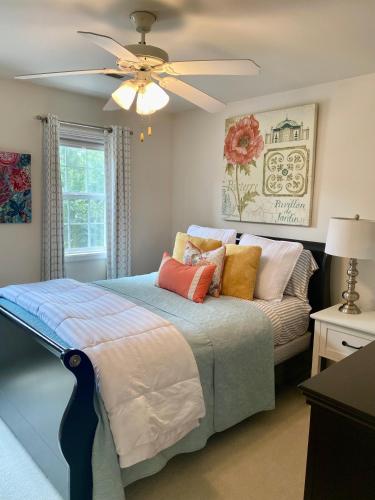 a bedroom with a bed and a ceiling fan at Suite Melissa's Pinehurst Country Club #6 Private Room and Bath in Pinehurst