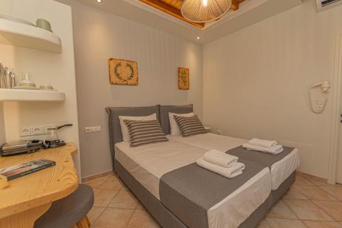 Ένα ή περισσότερα κρεβάτια σε δωμάτιο στο Naxian City Rooms