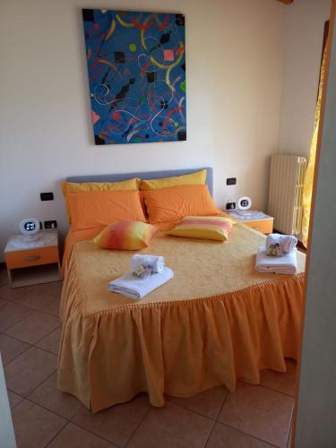 a bedroom with a bed with two towels on it at Appartamento Fiordaliso 2 in Montichiari
