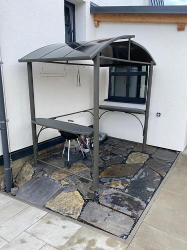a table with a chair under it on a patio at Vila Kosmonautka - Velké Losiny in Velké Losiny
