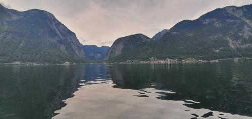 a large body of water in front of some mountains at Ferienwohnung Brader in Hallstatt