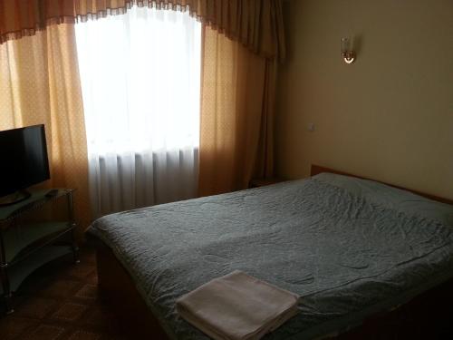 Postel nebo postele na pokoji v ubytování Semey Hotel