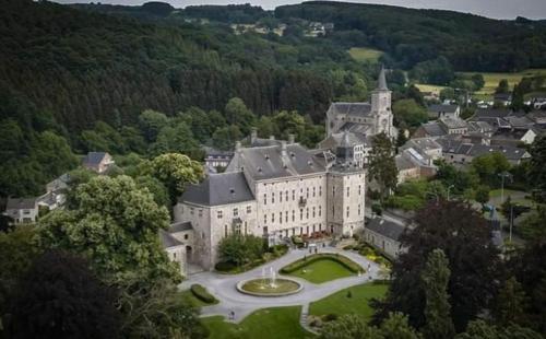 an aerial view of a large building with a courtyard at Chambre Aqualine in Aywaille