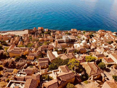 an aerial view of a village next to the ocean at Ritsos Family Apartment in Monemvasia