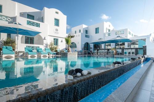 a swimming pool in front of a hotel at Anastasia Princess Luxury Beach Residence - Adults Only in Perissa