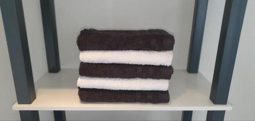 a stack of towels sitting on a chair at Feriendomizil zwischen Badeb-Baden - Offenburg in Ottenhöfen