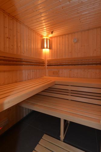 an empty sauna with a light in the middle at Wellness Pension Fulda Černý Důl in Cerny Dul