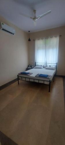 a bedroom with a large bed in a room at The Pereira's Goan Homestay Villa in Vasco Da Gama