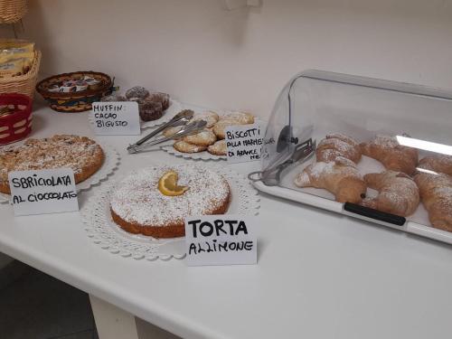 a table with different types of pastries on it at Al Giglio - Affittacamere in Cariati