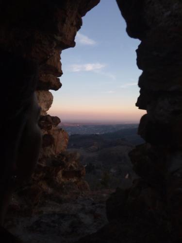 a view from a hole in a rock formation at Smeštaj Vrhovac in Vrdnik