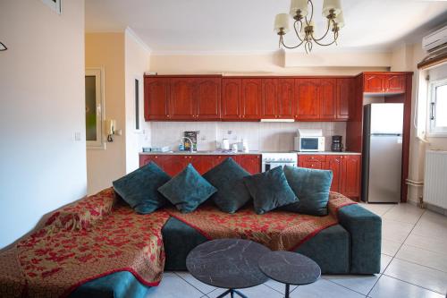 a living room with a bed and a kitchen at Erifili Luxury Apartment in Samos