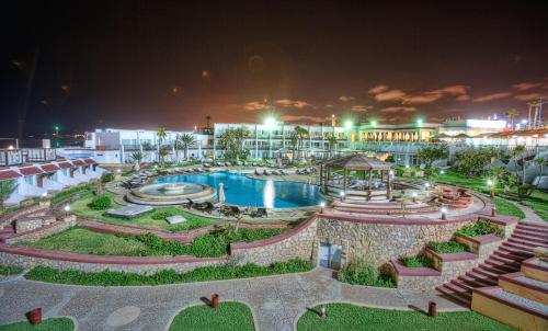 a resort with a swimming pool at night at Casablanca Le Lido Thalasso & Spa (ex Riad Salam) in Casablanca
