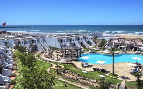 a view of a resort with a swimming pool and the ocean at Casablanca Le Lido Thalasso & Spa (ex Riad Salam) in Casablanca
