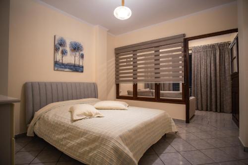 Ένα ή περισσότερα κρεβάτια σε δωμάτιο στο Ariadni Luxury Apartment