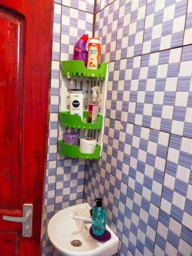 a bathroom with a sink and a toilet in it at Phee home in Mombasa
