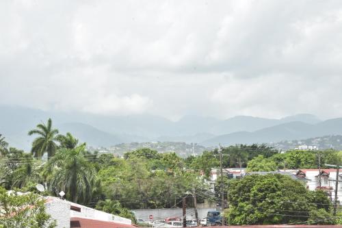 a view of a city with mountains in the background at Royal Exquisite Deluxe B&B in Kingston