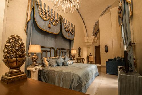 A bed or beds in a room at Palacio Borghese Hotel Boutique - Adults Only
