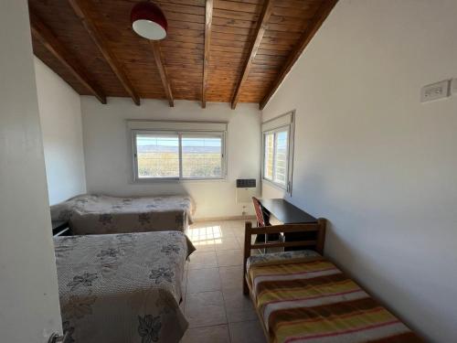 Ένα ή περισσότερα κρεβάτια σε δωμάτιο στο Balcones del Arroyo
