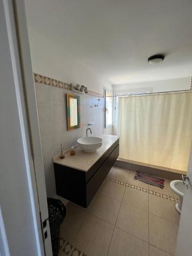 a bathroom with a sink and a toilet and a shower at Balcones del Arroyo in Nono